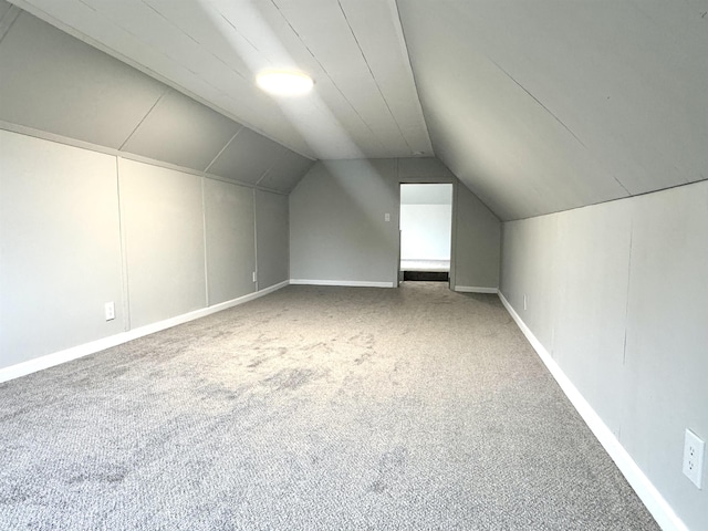217 Clyde St, Newport City, VT 05855 - bonus room featuring carpet flooring, vaulted ceiling, and baseboards