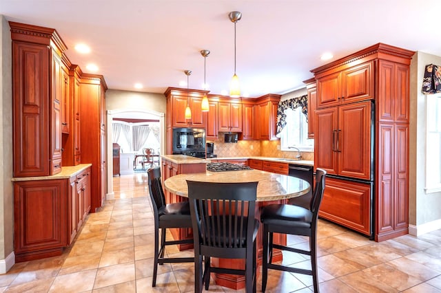 16 Gilboa Ln, Nashua, NH 03062 - kitchen with baseboards, healthy amount of natural light, a sink, a center island, and recessed lighting