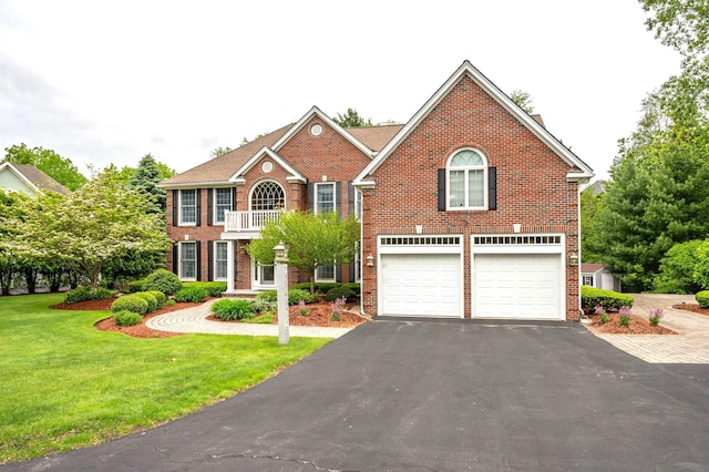 16 Gilboa Ln, Nashua, NH 03062 - view of front facade featuring asphalt driveway, brick siding, an attached garage, and a front lawn