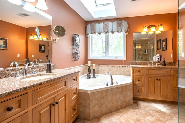16 Gilboa Ln, Nashua, NH 03062 - full bath featuring two vanities, a skylight, a stall shower, and a bath