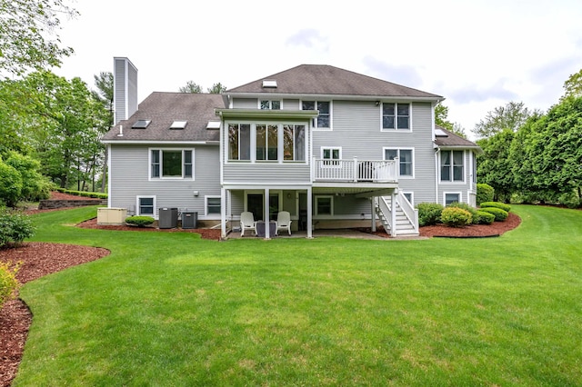 16 Gilboa Ln, Nashua, NH 03062 - back of property featuring stairs, a chimney, a wooden deck, and cooling unit