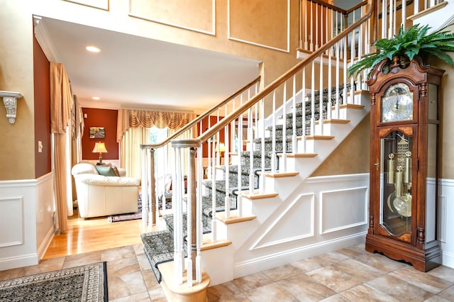 16 Gilboa Ln, Nashua, NH 03062 - stairs with a decorative wall, wainscoting, and recessed lighting