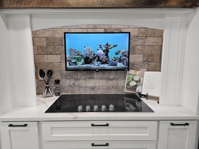 436 Mammoth Rd, Pelham, NH 03076 - kitchen featuring black electric cooktop, white cabinets, and light stone countertops