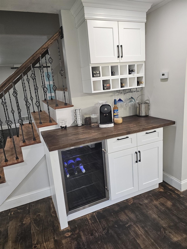 436 Mammoth Rd, Pelham, NH 03076 - bar with wine cooler, dark wood finished floors, baseboards, and stairway