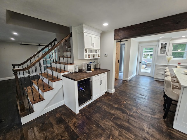 436 Mammoth Rd, Pelham, NH 03076 - indoor dry bar featuring beverage cooler, baseboards, dark wood-style flooring, and recessed lighting