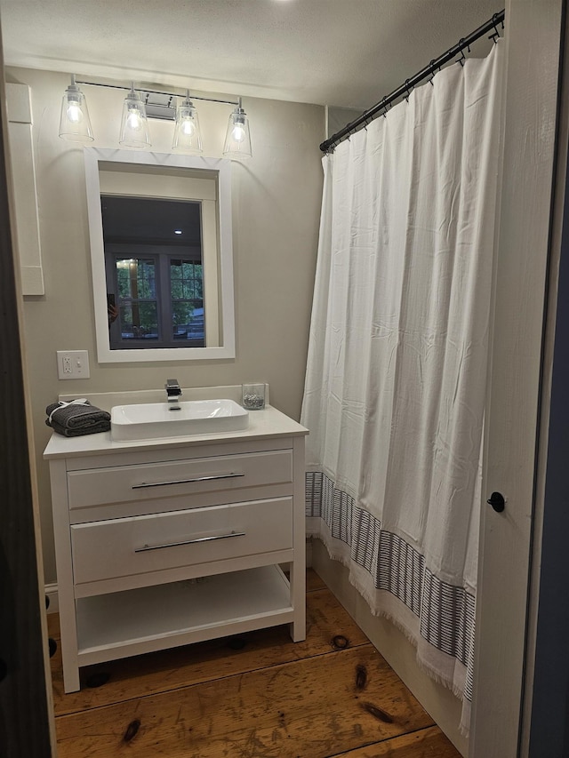 436 Mammoth Rd, Pelham, NH 03076 - bathroom featuring vanity, wood finished floors, and curtained shower