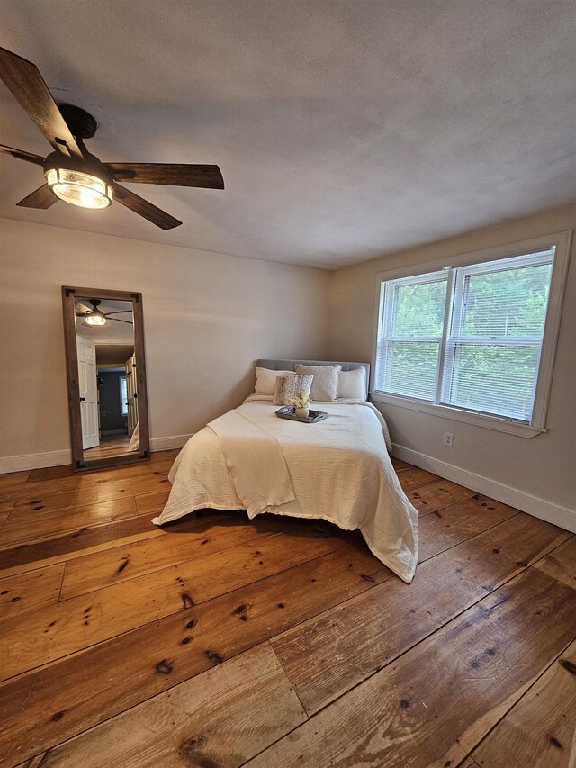 436 Mammoth Rd, Pelham, NH 03076 - bedroom with hardwood / wood-style flooring, baseboards, and a ceiling fan