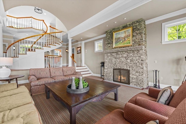 1097 Taber Ridge Rd, Stowe, VT 05672 - living room with stairs, plenty of natural light, a stone fireplace, baseboards, and crown molding