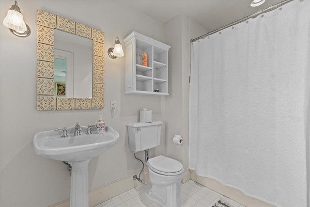 1097 Taber Ridge Rd, Stowe, VT 05672 - bathroom with tile patterned floors, toilet, a shower with shower curtain, and baseboards