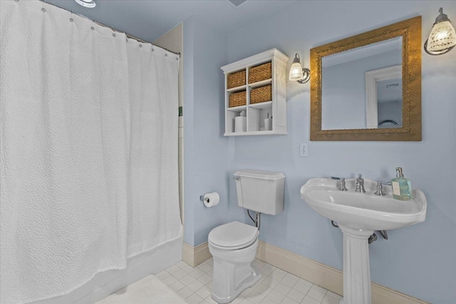 1097 Taber Ridge Rd, Stowe, VT 05672 - bathroom with tile patterned floors, toilet, and baseboards