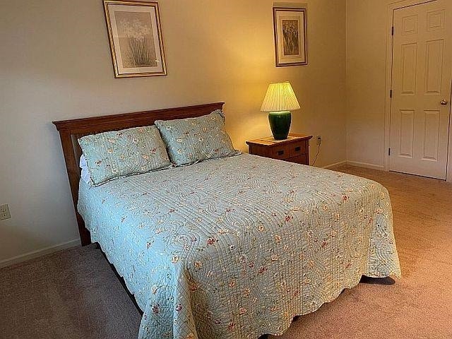 227 Main St Unit 232, Lincoln, NH 03251 - carpeted bedroom with baseboards