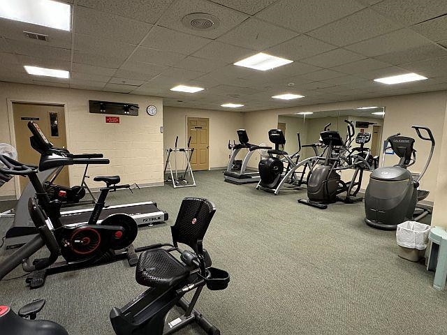 227 Main St Unit 232, Lincoln, NH 03251 - workout area with a paneled ceiling and carpet flooring