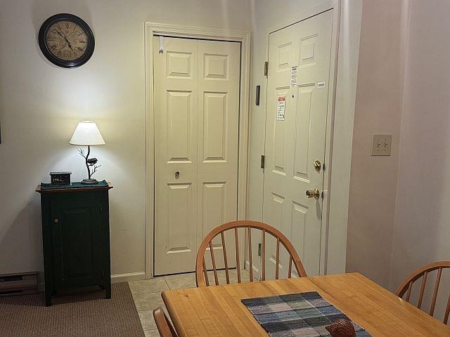 227 Main St Unit 232, Lincoln, NH 03251 - dining space with baseboards and light tile patterned floors