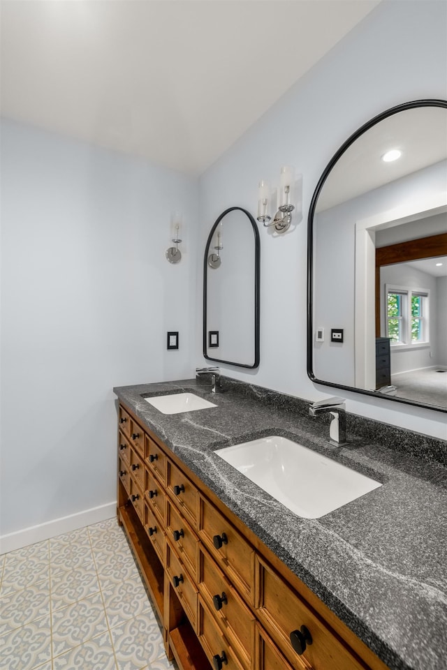 47 Hollow View Rd, Stowe, VT 05672 - bathroom with double vanity and baseboards