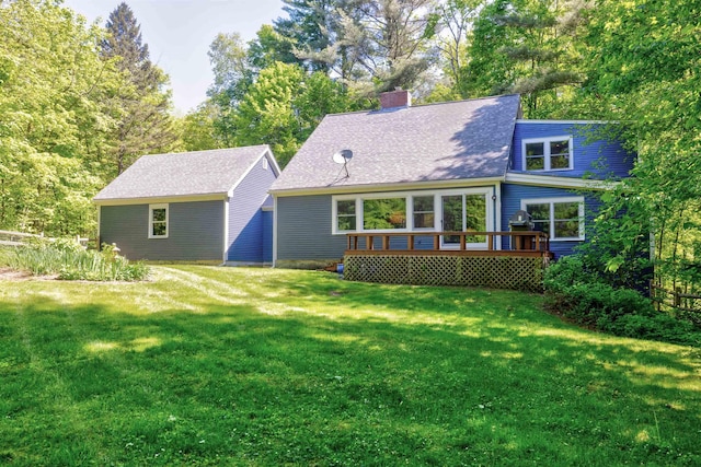 47 Hollow View Rd, Stowe, VT 05672 - back of property featuring a wooden deck, a yard, a chimney, and a shingled roof