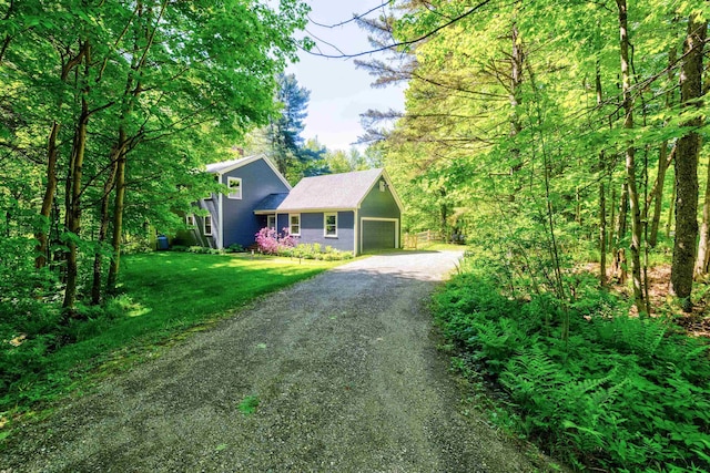 47 Hollow View Rd, Stowe, VT 05672 - view of front of house with dirt driveway, an attached garage, and a front yard