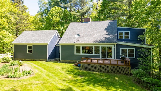 47 Hollow View Rd, Stowe, VT 05672 - back of property featuring a chimney, a deck, a lawn, and a shingled roof