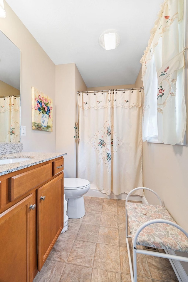 7 Elystan Cir, Nashua, NH 03064 - full bathroom featuring vanity, toilet, and a shower with shower curtain