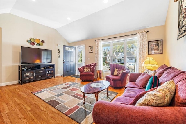 7 Elystan Cir, Nashua, NH 03064 - living area featuring vaulted ceiling, light wood finished floors, and baseboards