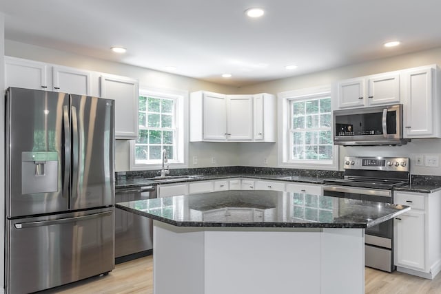 38 Howard Hill Rd, Jaffrey, NH 03452 - kitchen with appliances with stainless steel finishes, a sink, white cabinets, dark stone counters, and light wood-style floors