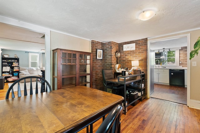 194 Pleasant St, Bristol, NH 03222 - dining room with hardwood / wood-style flooring and a textured ceiling