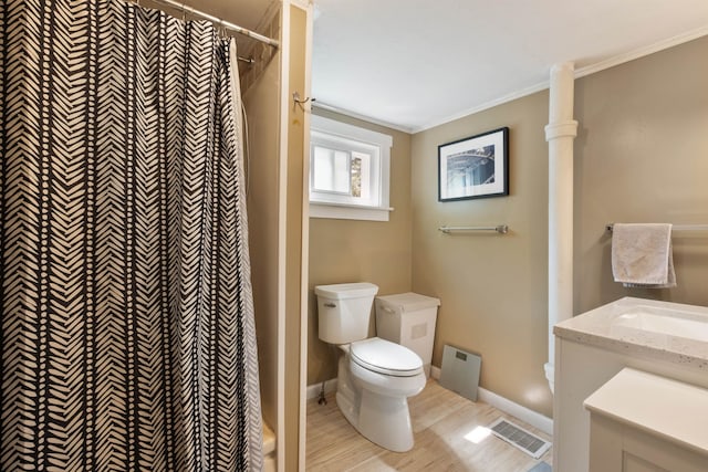 194 Pleasant St, Bristol, NH 03222 - bathroom with toilet, wood finished floors, vanity, a shower with curtain, and ornamental molding