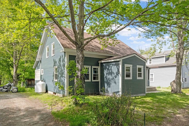 194 Pleasant St, Bristol, NH 03222 - view of home's exterior featuring a shingled roof