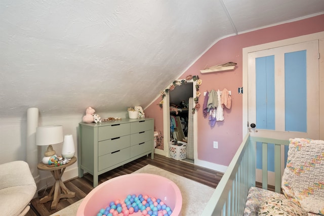 194 Pleasant St, Bristol, NH 03222 - bedroom with wood finished floors, baseboards, and vaulted ceiling