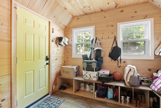 194 Pleasant St, Bristol, NH 03222 - mudroom with vaulted ceiling, wood ceiling, wood finished floors, and wooden walls