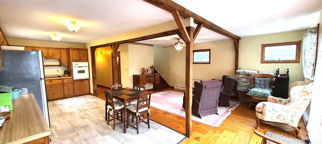 21 Triton Dr, Rye, NH 03870 - dining space with ceiling fan, light wood-type flooring, and baseboard heating