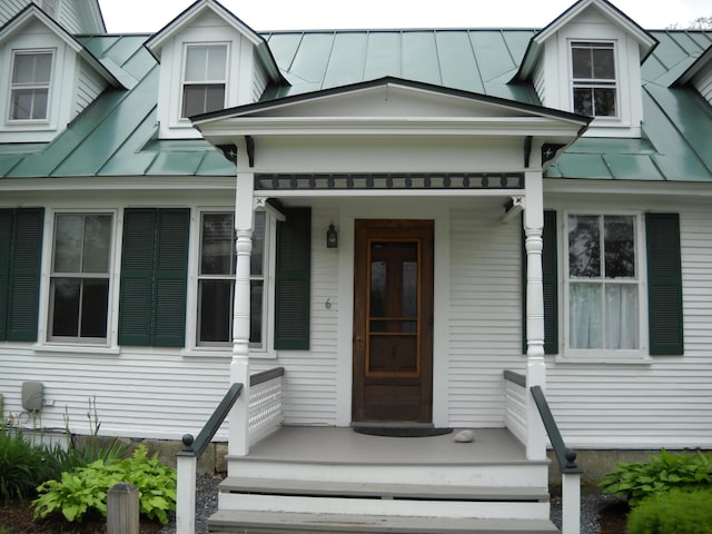 6 On The Cmn Unit 5, Lyme, NH 03768 - doorway to property with a standing seam roof, a metal roof, and a porch