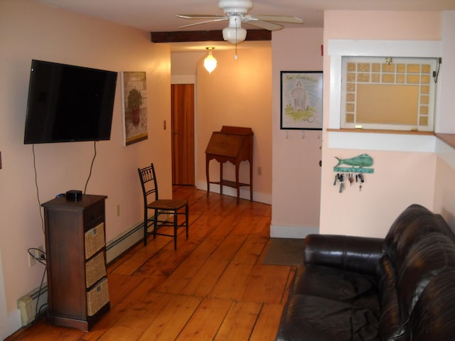 6 On The Cmn Unit 5, Lyme, NH 03768 - living area featuring a ceiling fan, hardwood / wood-style flooring, and a baseboard heating unit
