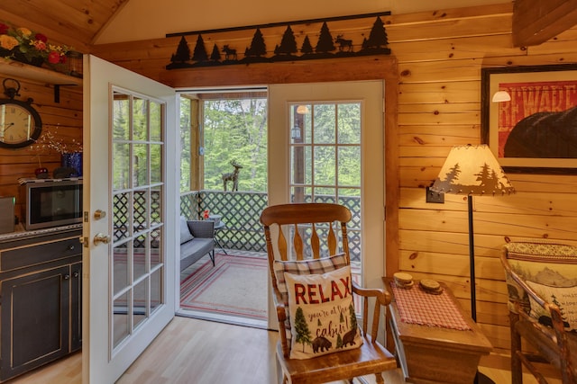 3233 Stinson Lake Rd, Ellsworth, NH 03266 - doorway featuring wooden walls, light wood finished floors, and lofted ceiling