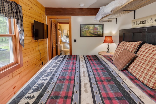 3233 Stinson Lake Rd, Ellsworth, NH 03266 - bedroom featuring wood walls and multiple windows