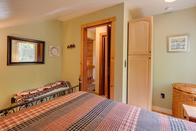 3233 Stinson Lake Rd, Ellsworth, NH 03266 - bedroom with baseboards and vaulted ceiling