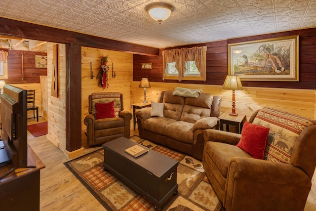3233 Stinson Lake Rd, Ellsworth, NH 03266 - living room with an ornate ceiling, wood walls, and wood finished floors