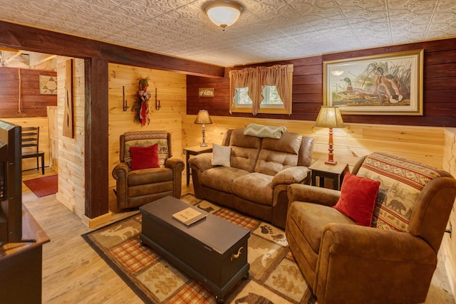 3233 Stinson Lake Rd, Ellsworth, NH 03266 - living room featuring an ornate ceiling, wooden walls, and wood finished floors