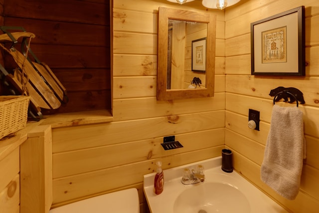 3233 Stinson Lake Rd, Ellsworth, NH 03266 - half bathroom with a sink, wooden walls, and toilet