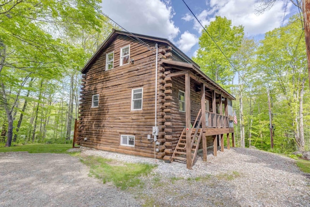 3233 Stinson Lake Rd, Ellsworth, NH 03266 - view of property exterior featuring log exterior