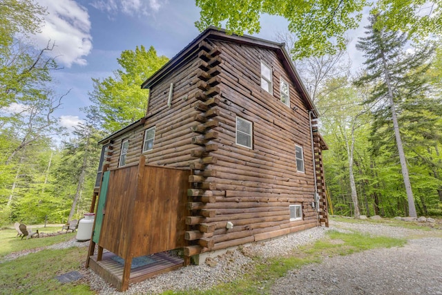 3233 Stinson Lake Rd, Ellsworth, NH 03266 - view of side of property featuring log exterior