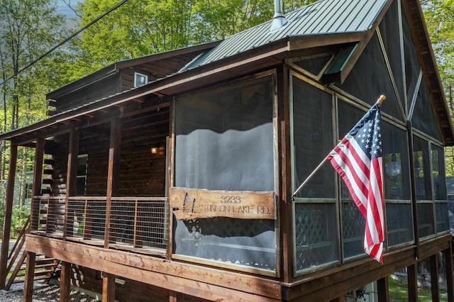 3233 Stinson Lake Rd, Ellsworth, NH 03266 - view of side of home featuring a standing seam roof and metal roof