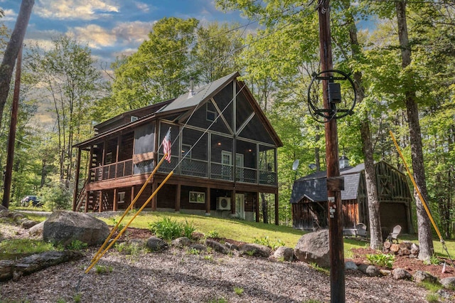 3233 Stinson Lake Rd, Ellsworth, NH 03266 - back of house with an outdoor structure, stairs, a wooden deck, and a yard