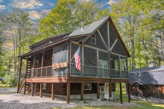 3233 Stinson Lake Rd, Ellsworth, NH 03266 - view of front of house featuring a sunroom and metal roof
