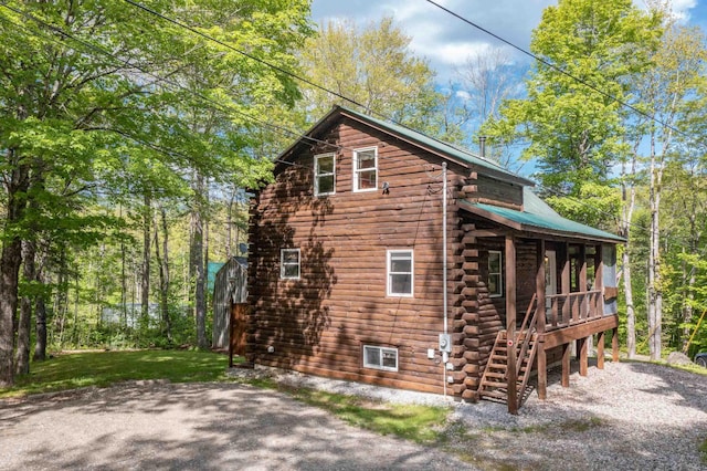 3233 Stinson Lake Rd, Ellsworth, NH 03266 - view of property exterior featuring log exterior