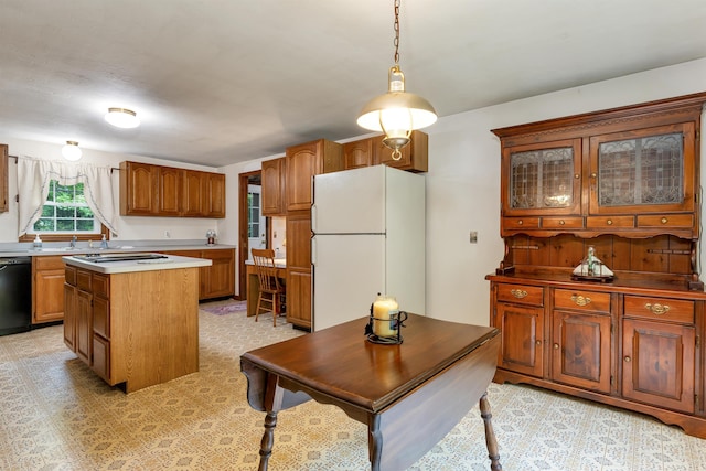 210 Province Rd, Belmont, NH 03220 - kitchen featuring freestanding refrigerator, black dishwasher, a center island, brown cabinets, and glass insert cabinets