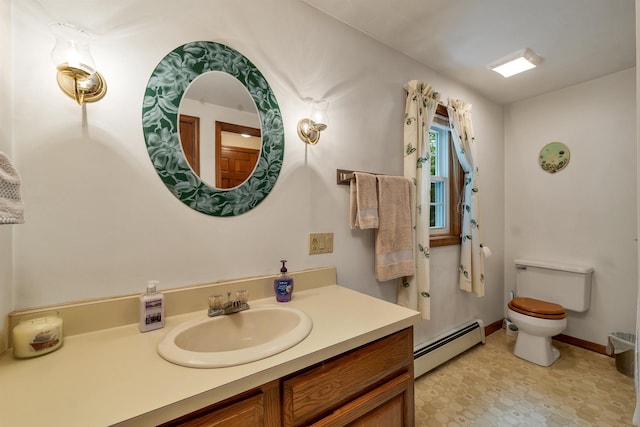 210 Province Rd, Belmont, NH 03220 - bathroom featuring a baseboard heating unit, vanity, toilet, and baseboards