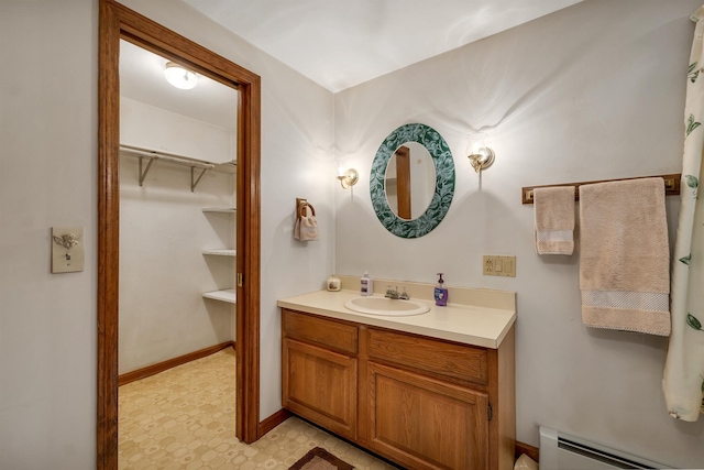 210 Province Rd, Belmont, NH 03220 - bathroom featuring a baseboard heating unit, vanity, and tile patterned floors