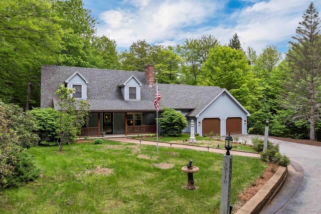 210 Province Rd, Belmont, NH 03220 - cape cod home featuring a porch, a garage, a chimney, a front yard, and driveway