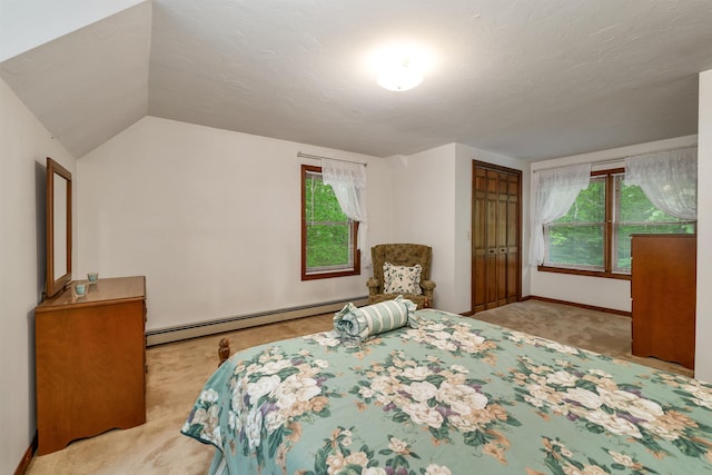 210 Province Rd, Belmont, NH 03220 - carpeted bedroom featuring a baseboard radiator, multiple windows, a closet, lofted ceiling, and baseboards