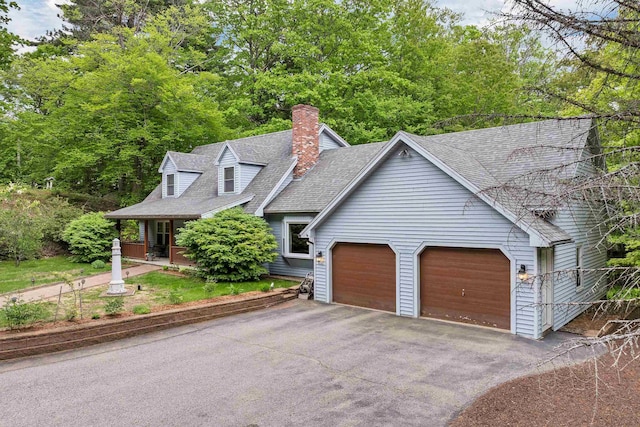 210 Province Rd, Belmont, NH 03220 - view of front of house with driveway, an attached garage, roof with shingles, a chimney, and a porch